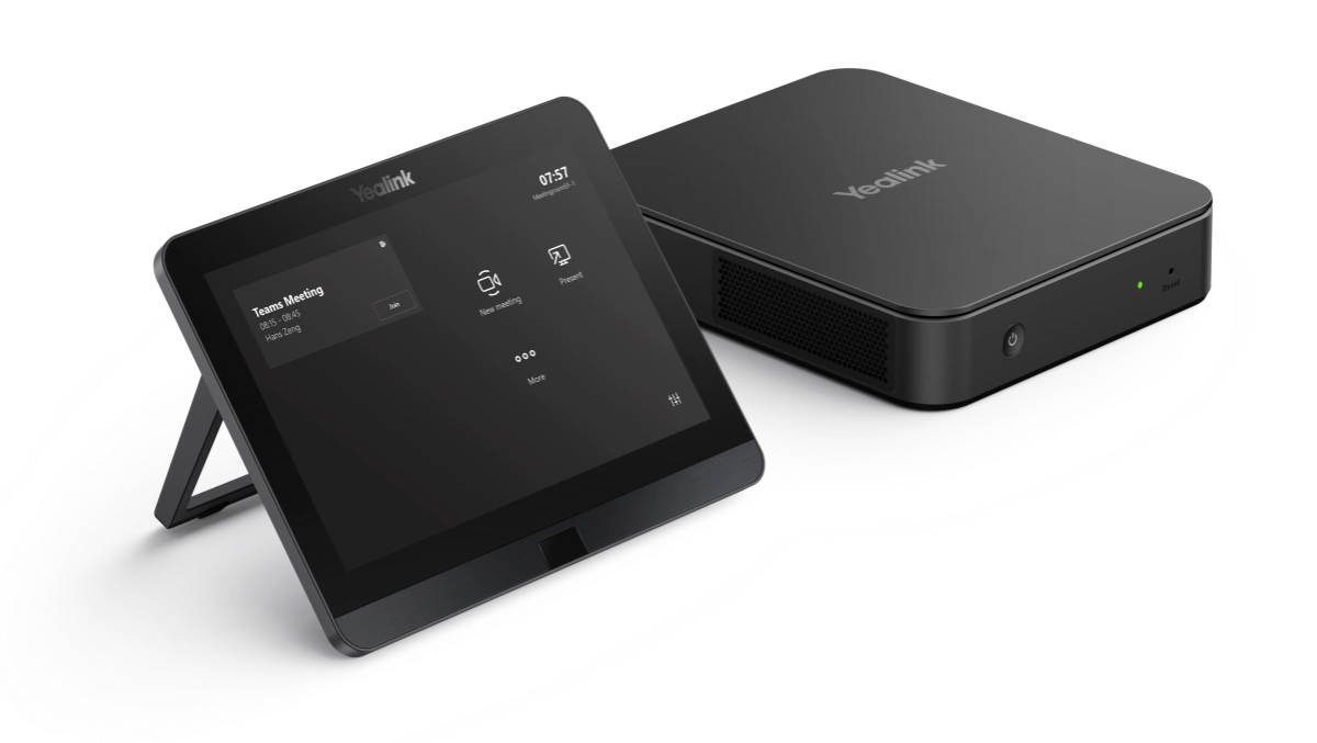 Angled view of the Yealink MCore Kit, showcasing the touch controller with its stand and the mini-PC.